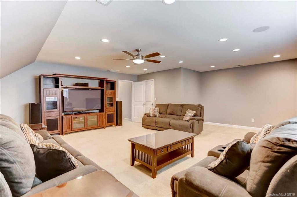 516 Rosemary Lane Fort Mill, SC 29708 - Photo 26 of 36 a living room with furniture and a flat screen tv