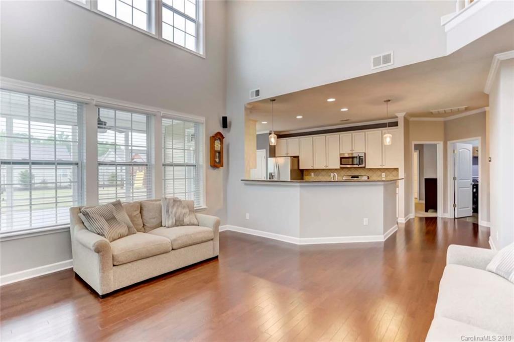 516 Rosemary Lane Fort Mill, SC 29708 - Photo 6 of 36 a living room with stainless steel appliances kitchen island granite countertop a couch and a large window