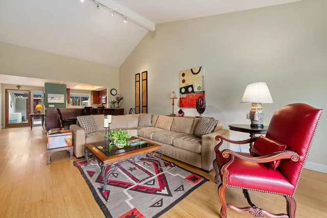 a living room with furniture and wooden floor