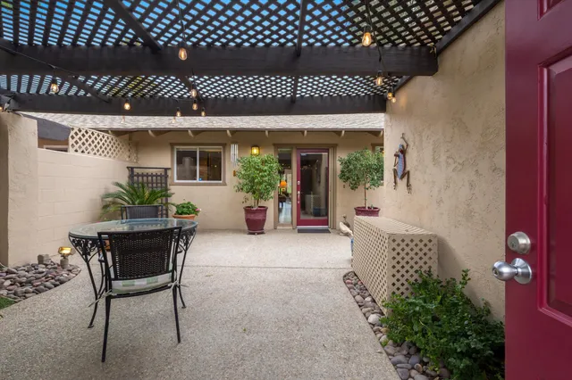 a patio with table and chairs