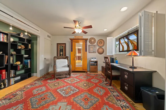 a bedroom with a bed dresser and a window