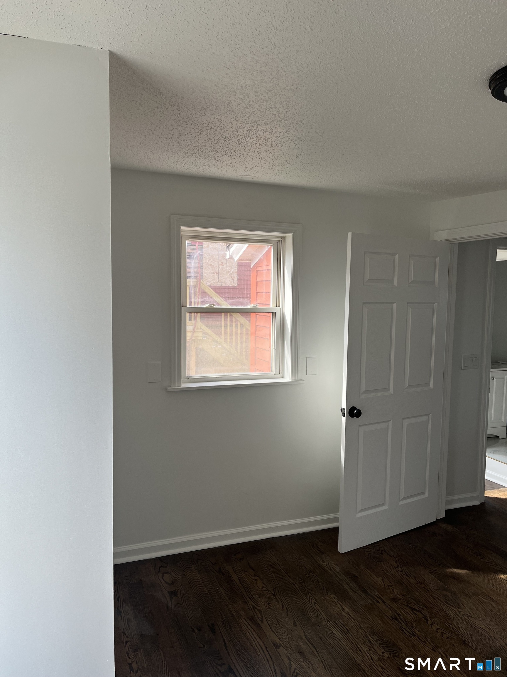 52 Pearl Street Manchester, CT 06040 - Photo 15 of 31 an empty room with wooden floor and windows