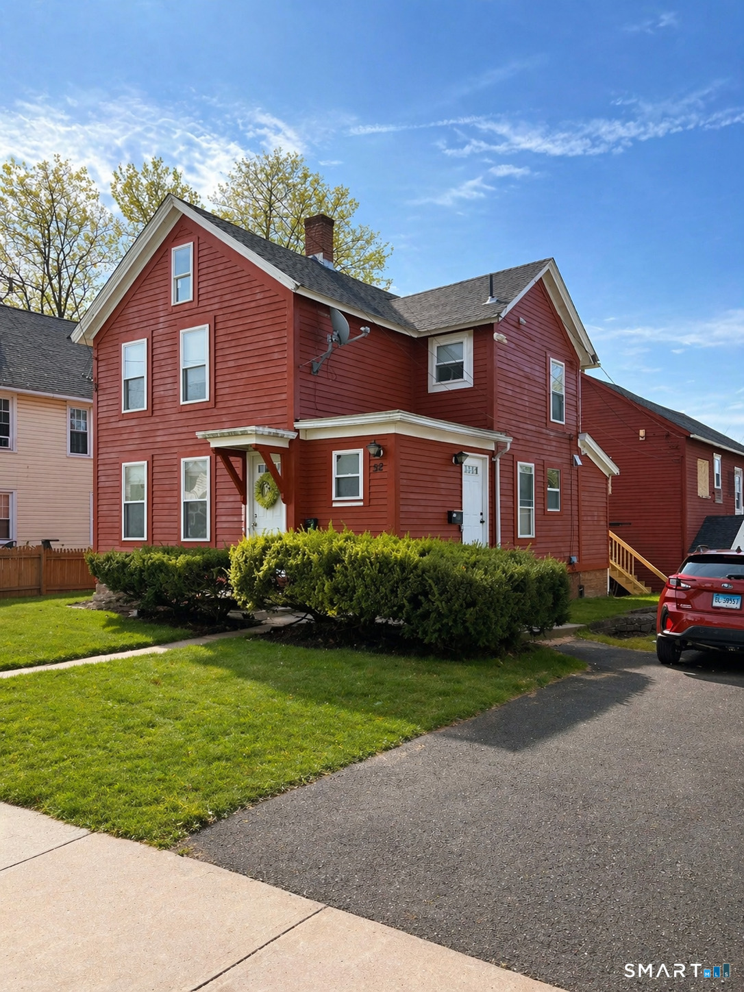 52 Pearl Street Manchester, CT 06040 - Photo 2 of 31 a front view of a house with a yard