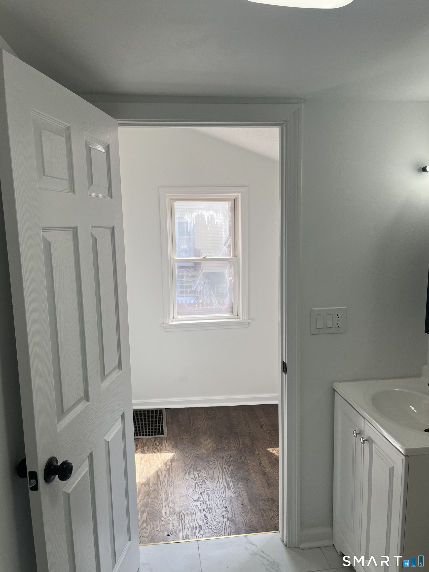 52 Pearl Street Manchester, CT 06040 - Photo 7 of 31 a view of a hallway with wooden floor and entryway