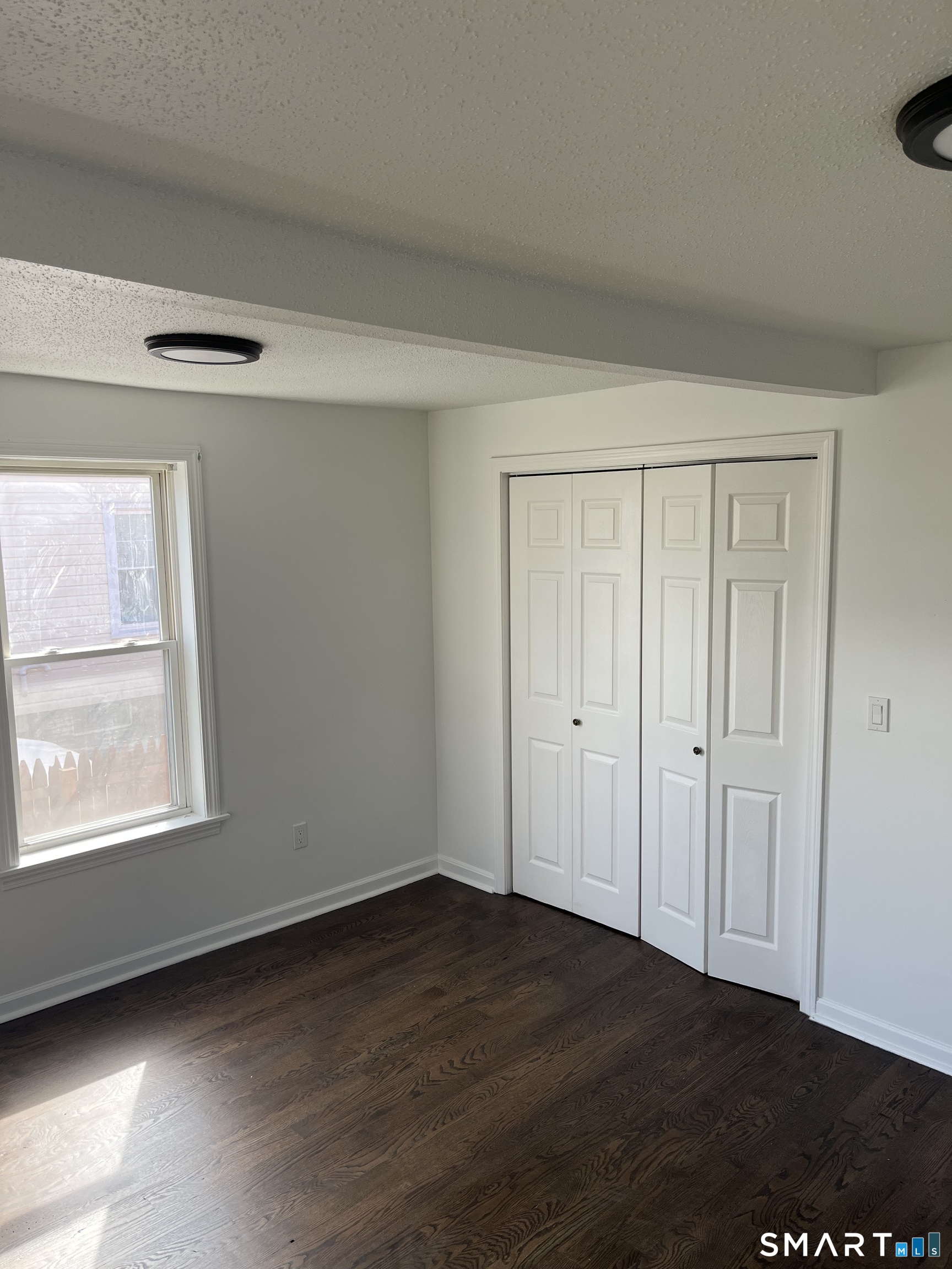 52 Pearl Street Manchester, CT 06040 - Photo 9 of 31 a view of an empty room and window