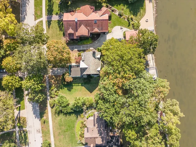 aerial view of a house with a yard
