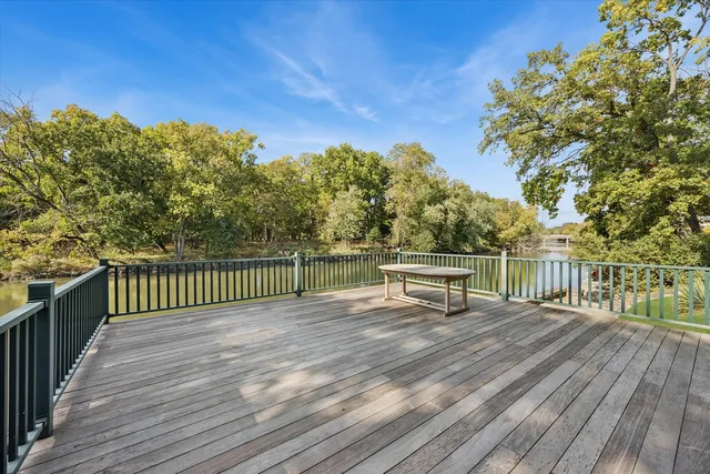 a view of deck with a large trees