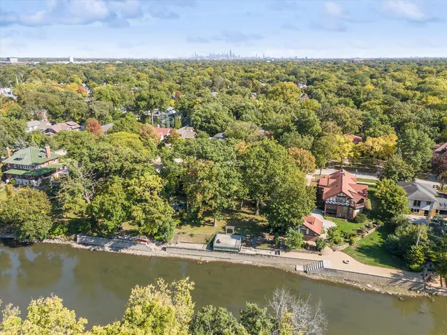 an aerial view of residential houses with lake view