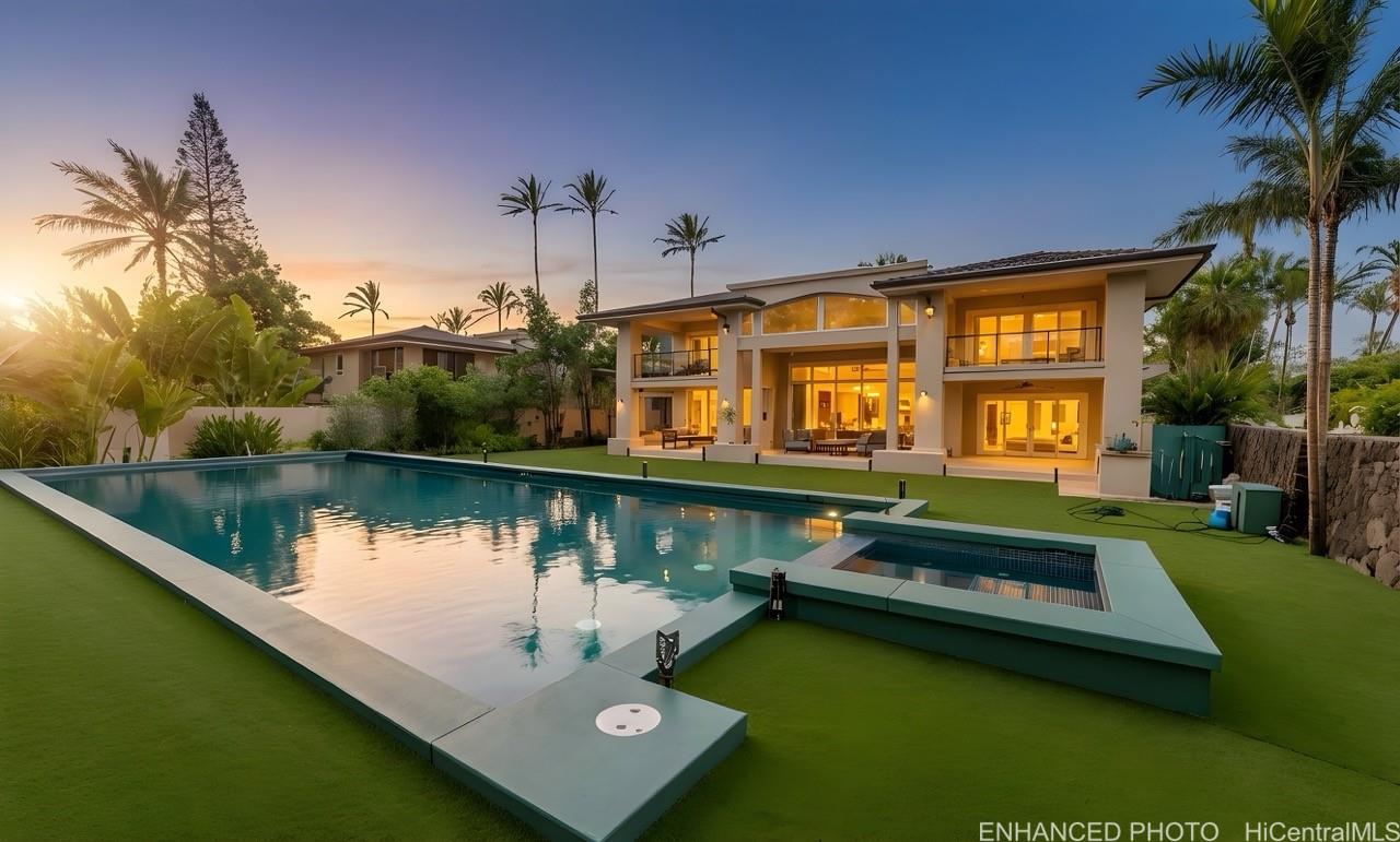 235 Portlock Road Honolulu, HI 96825 - Photo 1 of 21 a view of a house with swimming pool next to a lake view