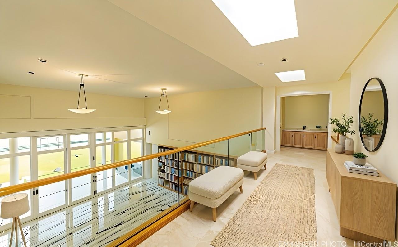 235 Portlock Road Honolulu, HI 96825 - Photo 7 of 21 a view of a large mirror with wooden floor