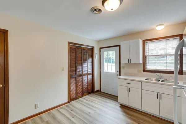 a view of cabinets and wooden floor
