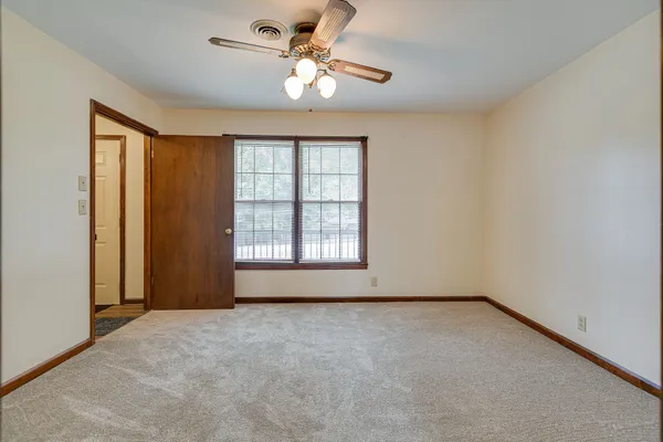 a view of an empty room with a window