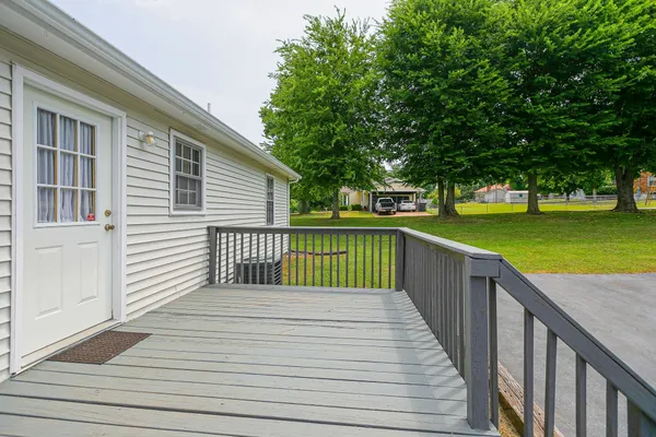 a view of a deck with a yard