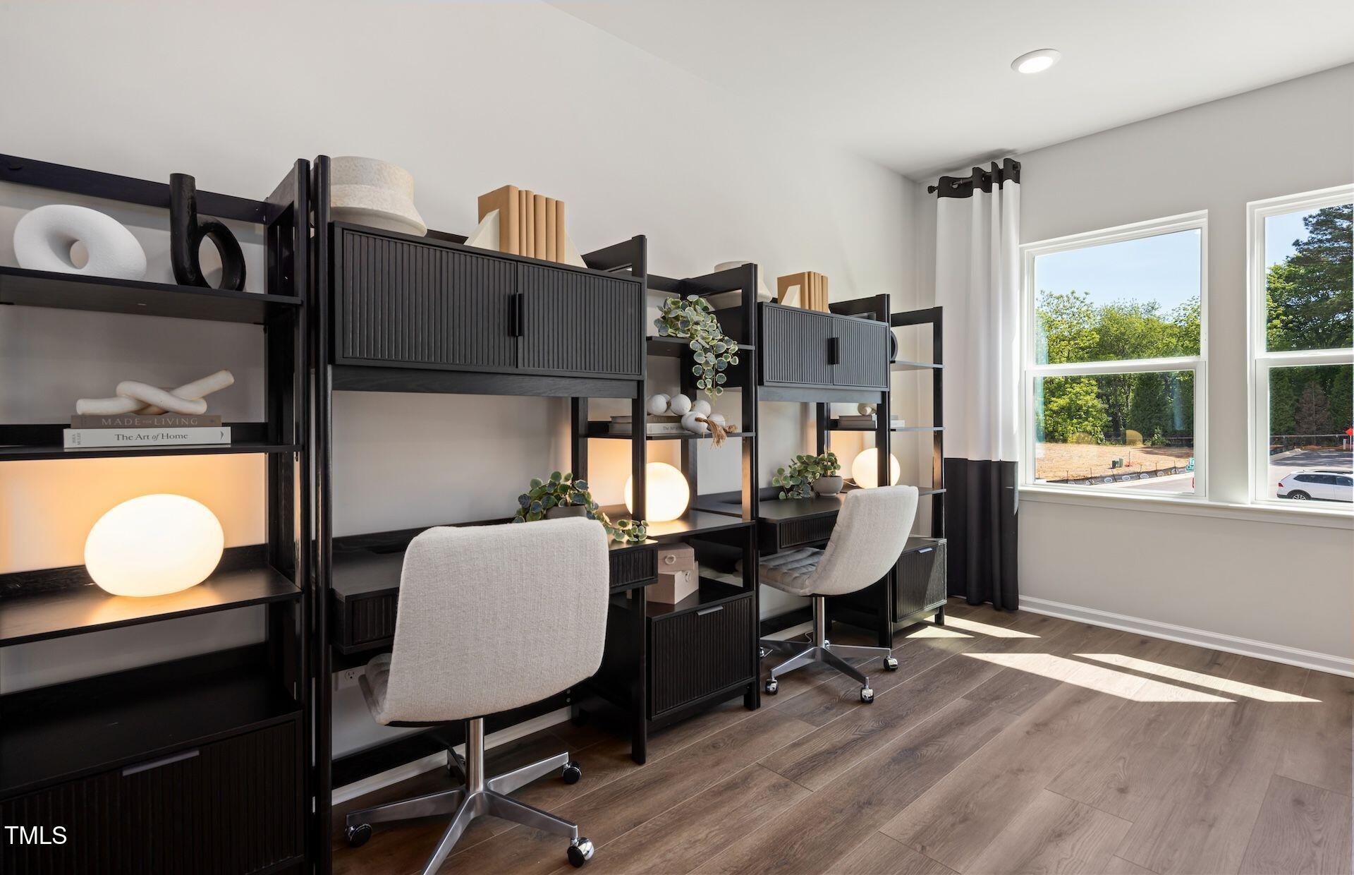 2783 Cassius Drive Apex, NC 27502 - Photo 8 of 18 a view of a workspace with furniture and a window