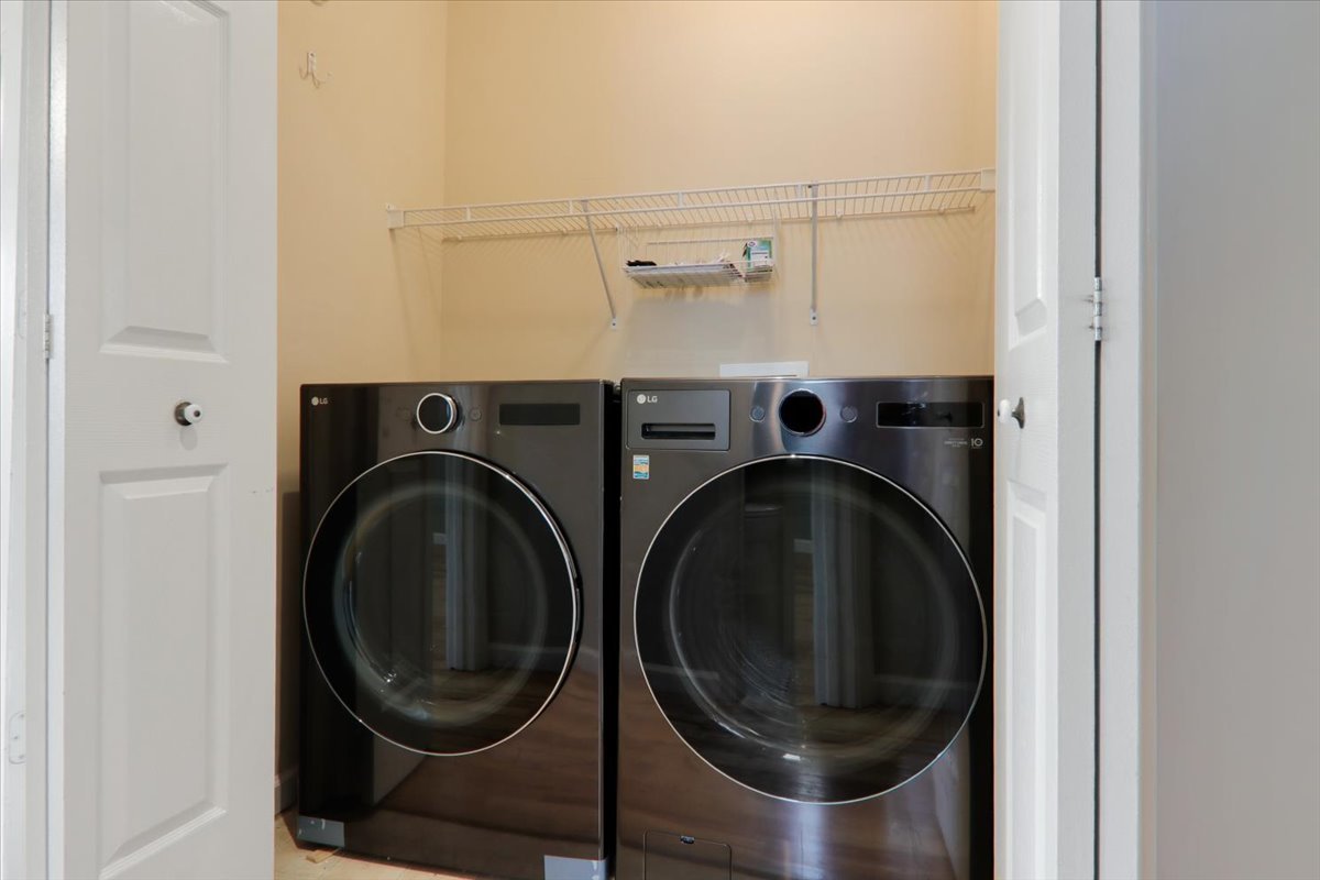 1401 River Landing Street Normal, IL 61761 - Photo 12 of 27 a utility room with dryer and washer