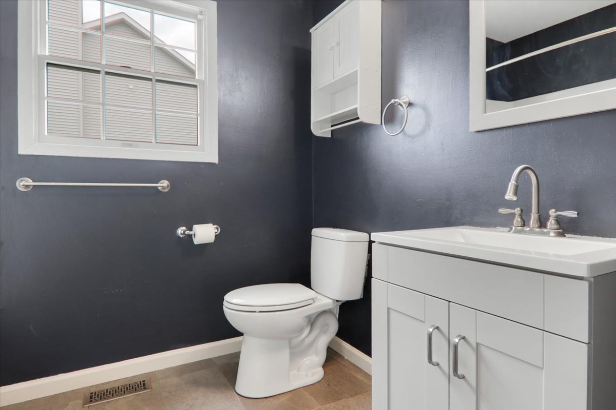 1401 River Landing Street Normal, IL 61761 - Photo 13 of 27 a bathroom with a sink a toilet and a mirror