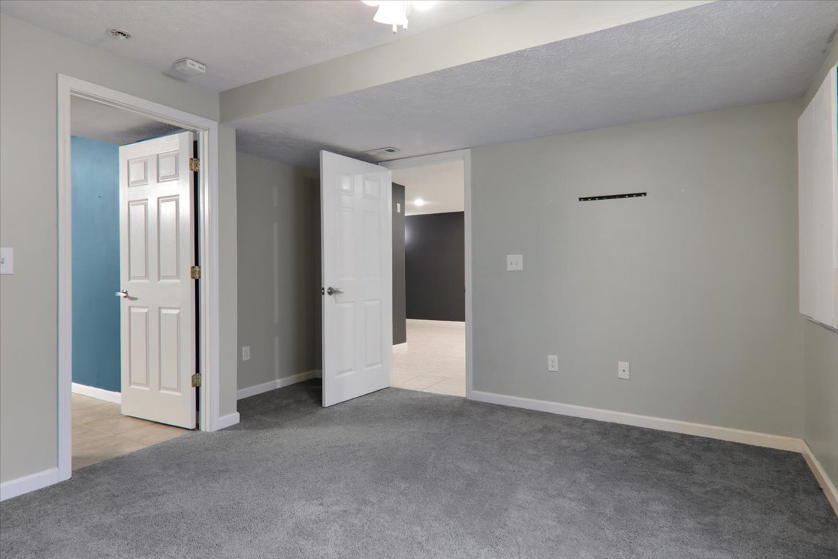 1401 River Landing Street Normal, IL 61761 - Photo 19 of 27 a view of an empty room with closet and a bathroom