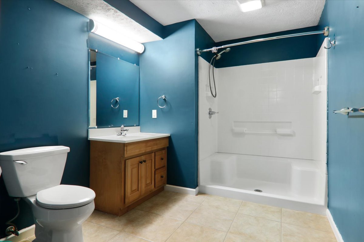 1401 River Landing Street Normal, IL 61761 - Photo 20 of 27 a bathroom with a toilet sink and shower