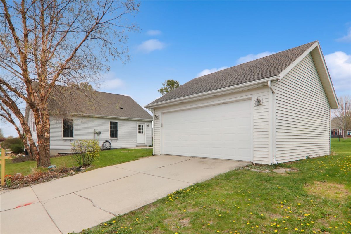 1401 River Landing Street Normal, IL 61761 - Photo 22 of 27 a front view of a house with a yard and garage
