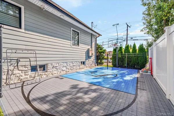 a view of a backyard with sitting area
