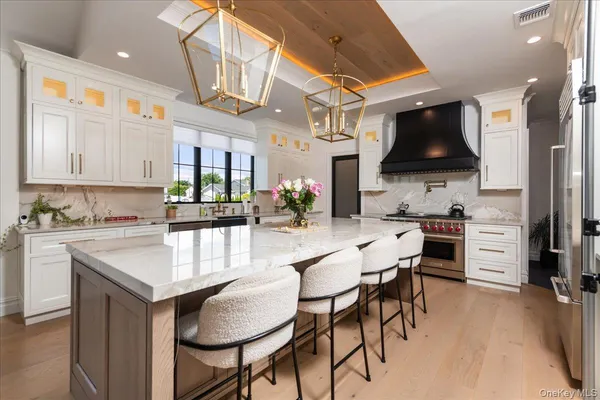 a kitchen with stainless steel appliances kitchen island granite countertop a sink and cabinets