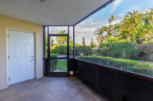 a view of a porch and a yard