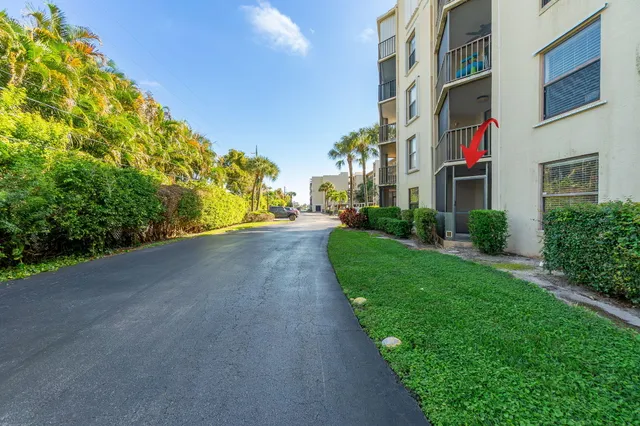 a view of a street with a building in the background
