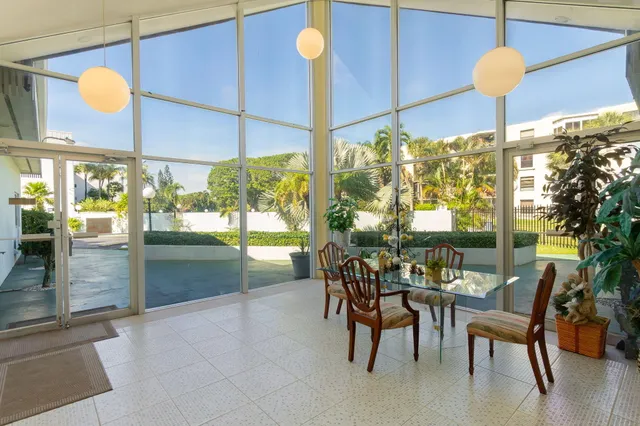 a view of a dining room with furniture window and outside floor