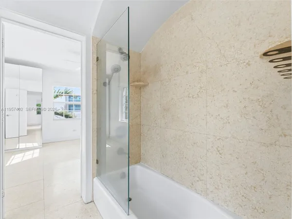 a bathroom with a double vanity sink and mirror