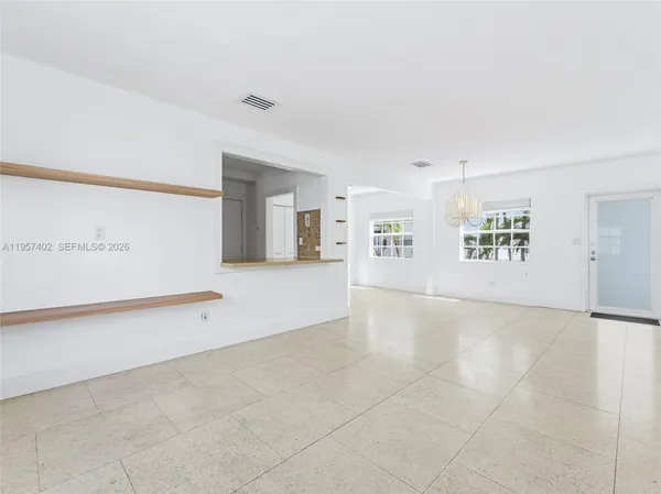 a living room with furniture and windows