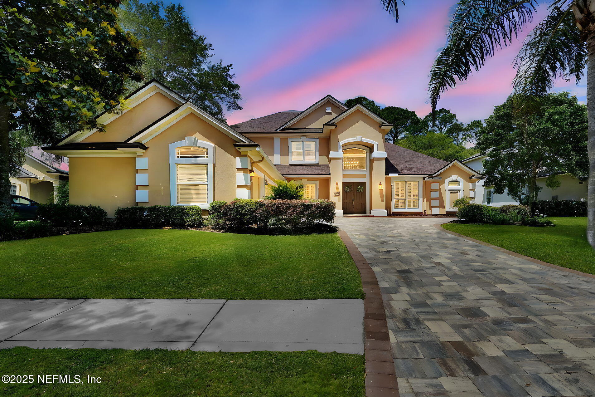 265 Oak Common Avenue St. Augustine, FL 32095 - Photo 6 of 116 a front view of a house with a yard and garage