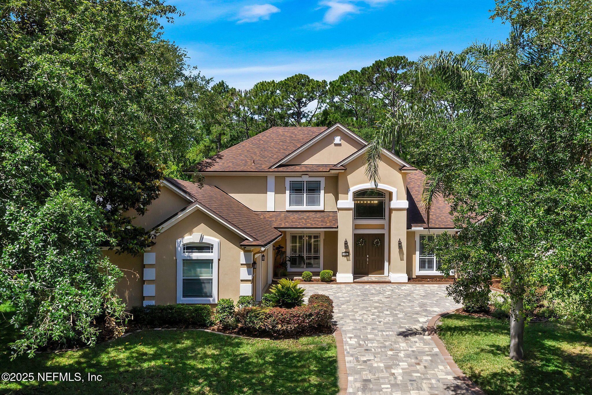 265 Oak Common Avenue St. Augustine, FL 32095 - Photo 10 of 116 a front view of a house with a yard