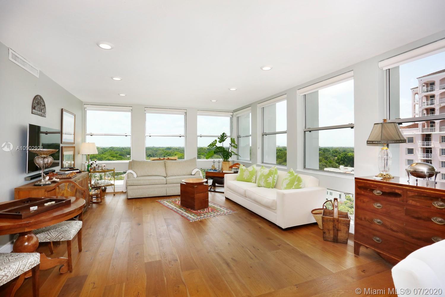 700 Biltmore Way, Unit 910 Coral Gables, FL 33134 - Photo 3 of 26 a living room with furniture and a large window