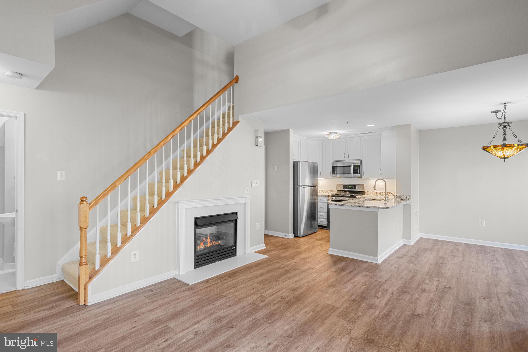 11844 Breton Court, Unit 19A Reston, VA 20191 - Photo 4 of 36 Snuggle up before the gas fireplace or...