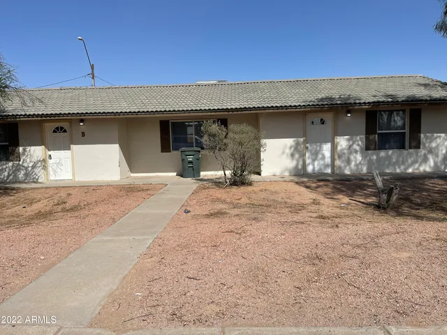 a view of a couches under an umbrella