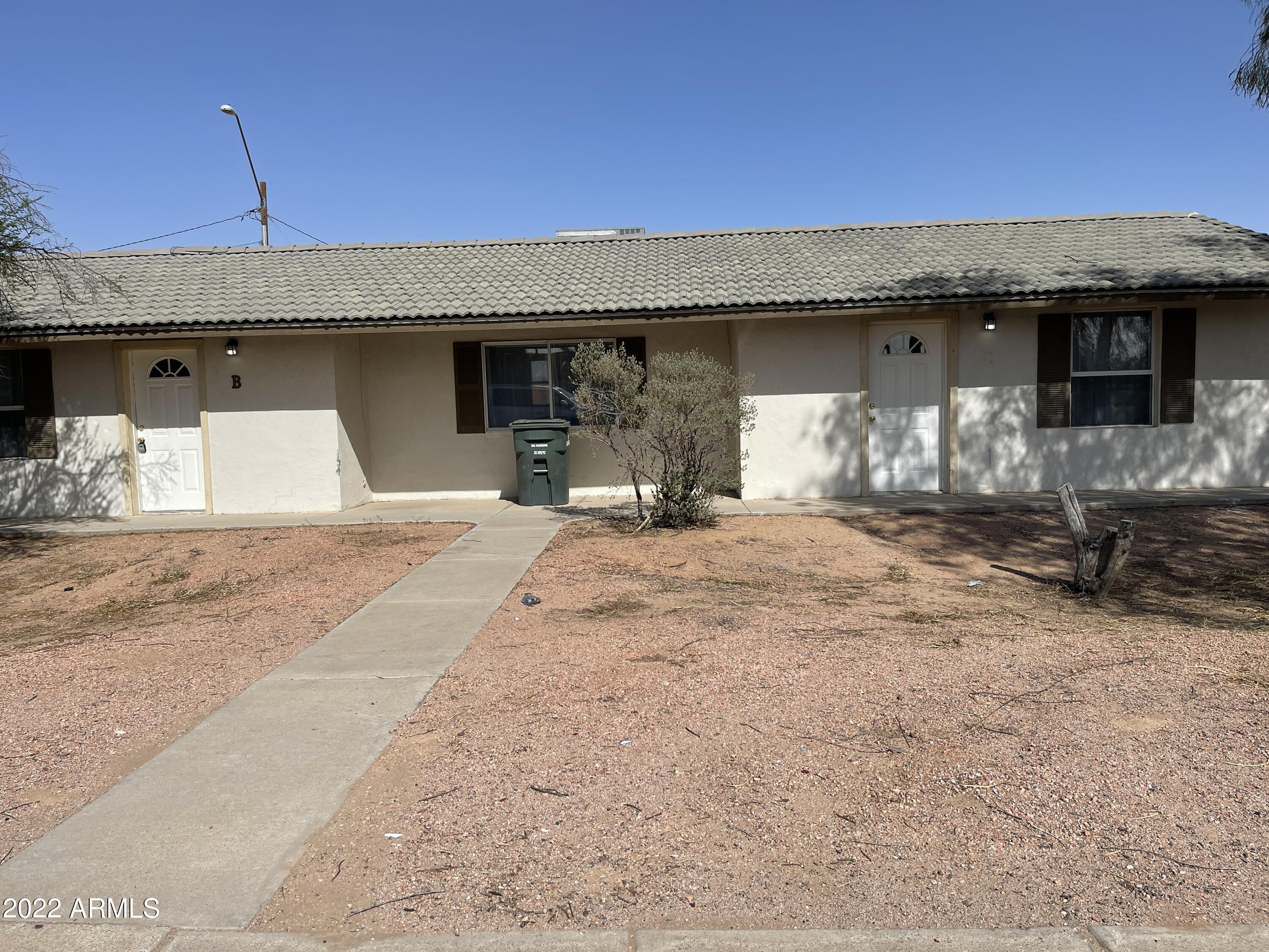 1504 North French Street, Unit B Casa Grande, AZ 85122 - Photo 1 of 23 a view of a couches under an umbrella