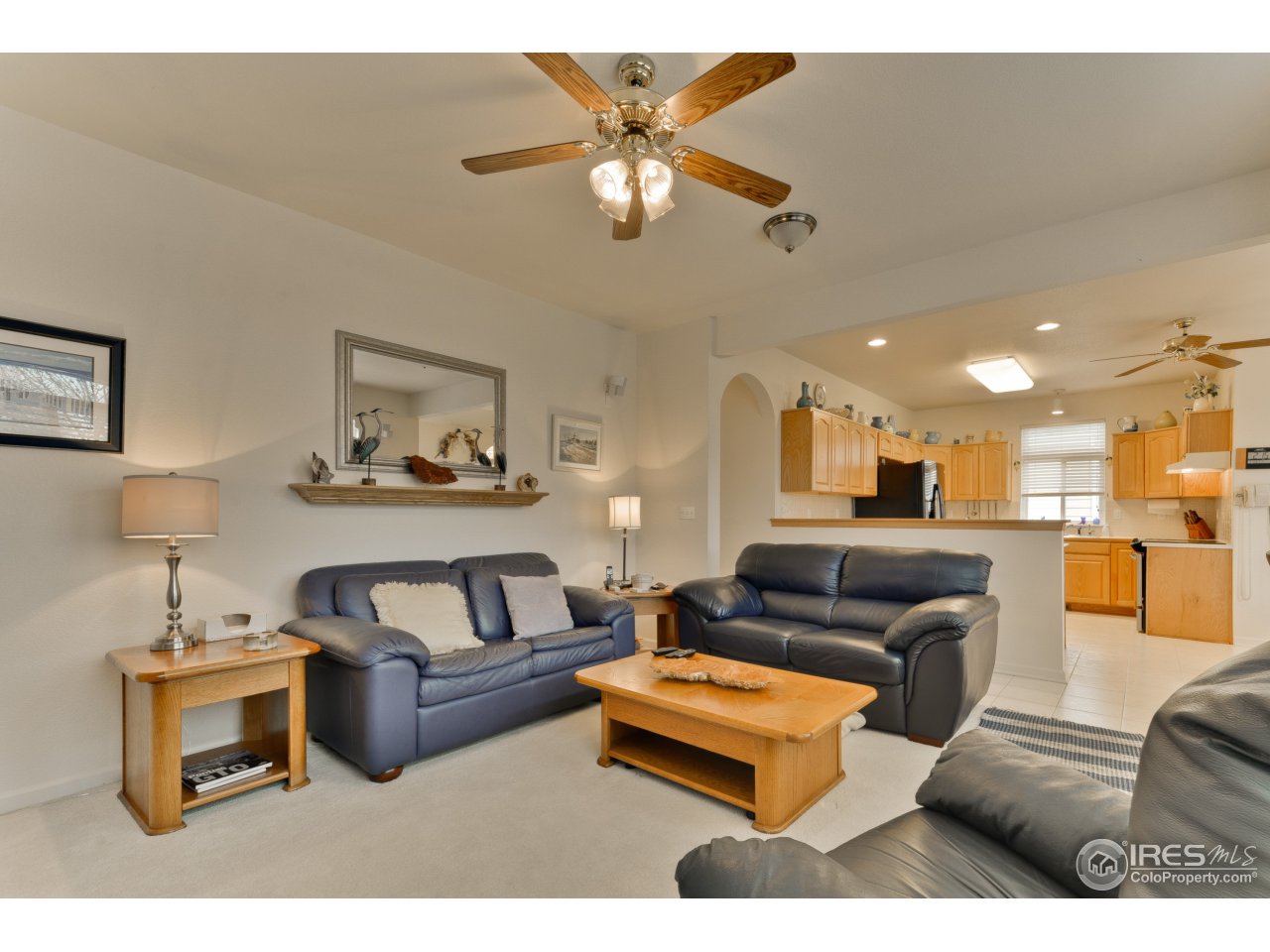 643 Rider Ridge Road Longmont, CO 80504 - Photo 21 of 40 a living room with furniture and a chandelier