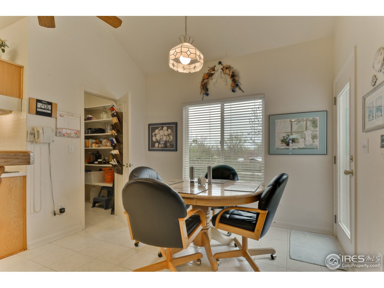 643 Rider Ridge Road Longmont, CO 80504 - Photo 26 of 40 a workspace with furniture and chandelier