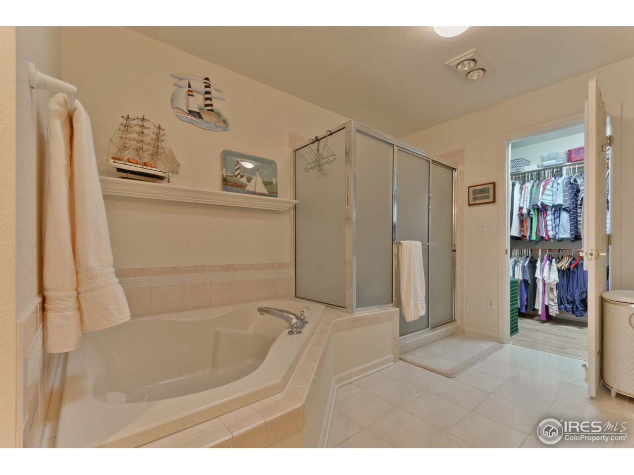643 Rider Ridge Road Longmont, CO 80504 - Photo 30 of 40 a bathroom with a bathtub and a shower