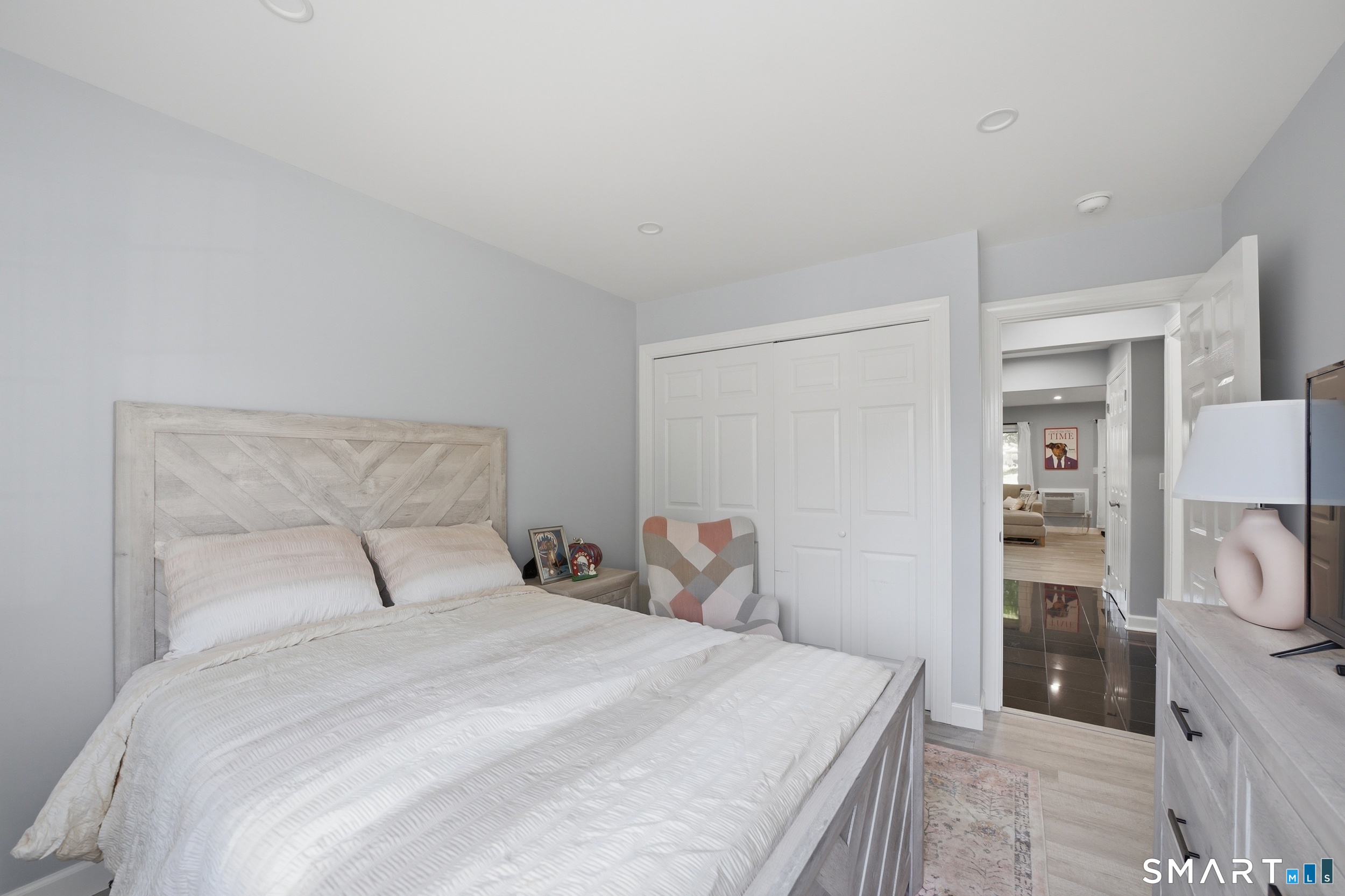 187 Flax Hill Road, Unit D1 Norwalk, CT 06854 - Photo 26 of 32 a bedroom with a bed and a view of bathroom