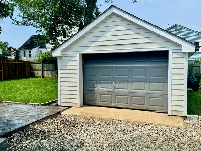 a small white house with a outdoor space