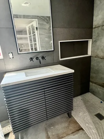 a bathroom with a sink and a mirror