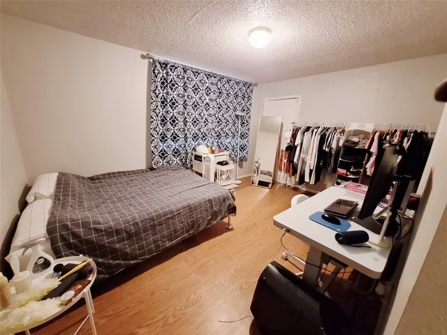 a bedroom with a bed and a walk in closet