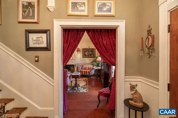 a living room with furniture and a dining table