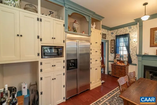 a bed with a black and white comforter