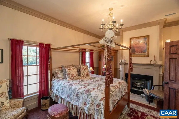 a living room with furniture chess table and a window