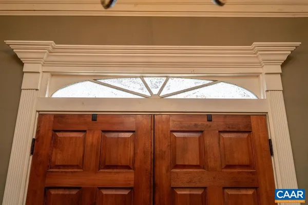 a view of a livingroom with hardwood floor and hallway