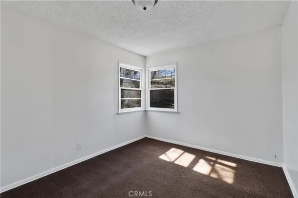 a view of empty room with windows