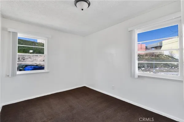 a view of a room that has a window in it