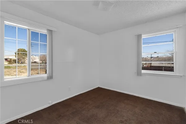 a view of a livingroom with an empty space and window